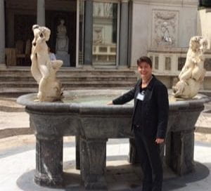 Jenny Reardon standing in front of a fountain at the Vatican.